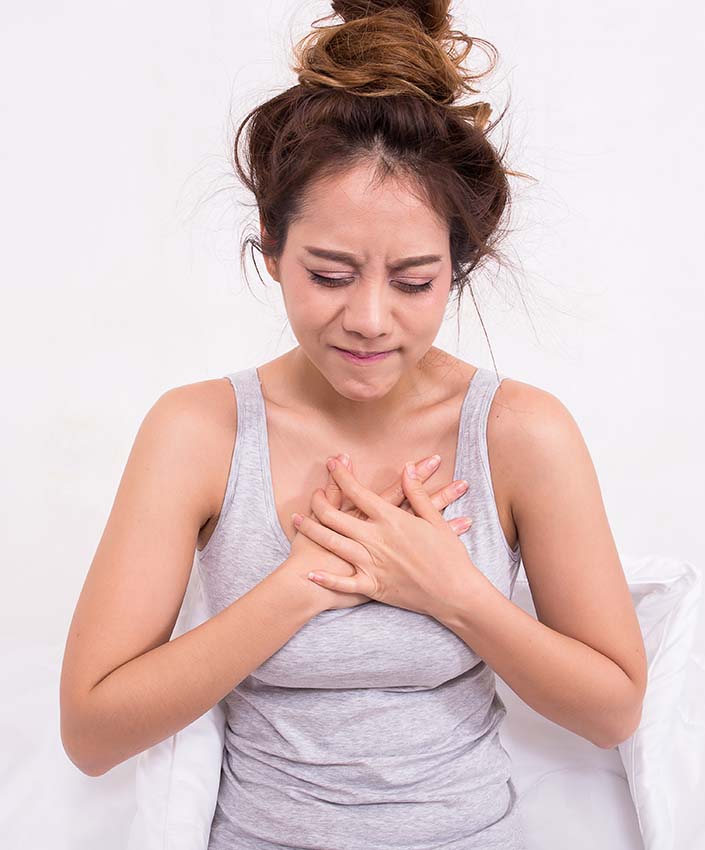 a woman suffering from heartburn