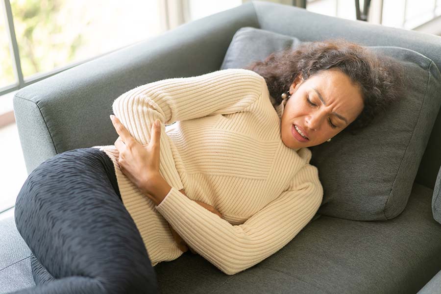 Woman suffering from gastritis
